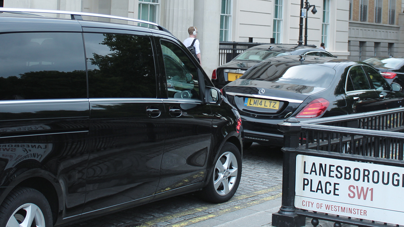 Chauffeur vehicle convoy outside Lanesborough hotel in London